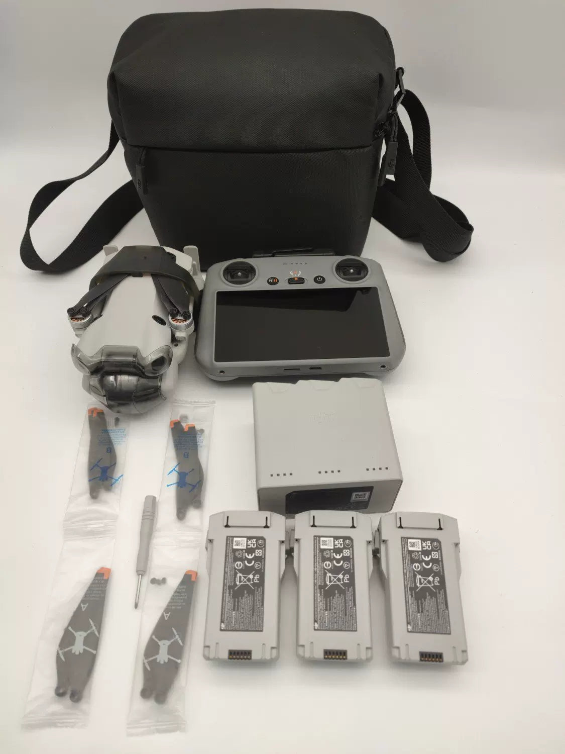 99% New (Mint) DJI Mini 4 Pro with Screen, Extended Battery Fly More Combo with DJI Care Refresh