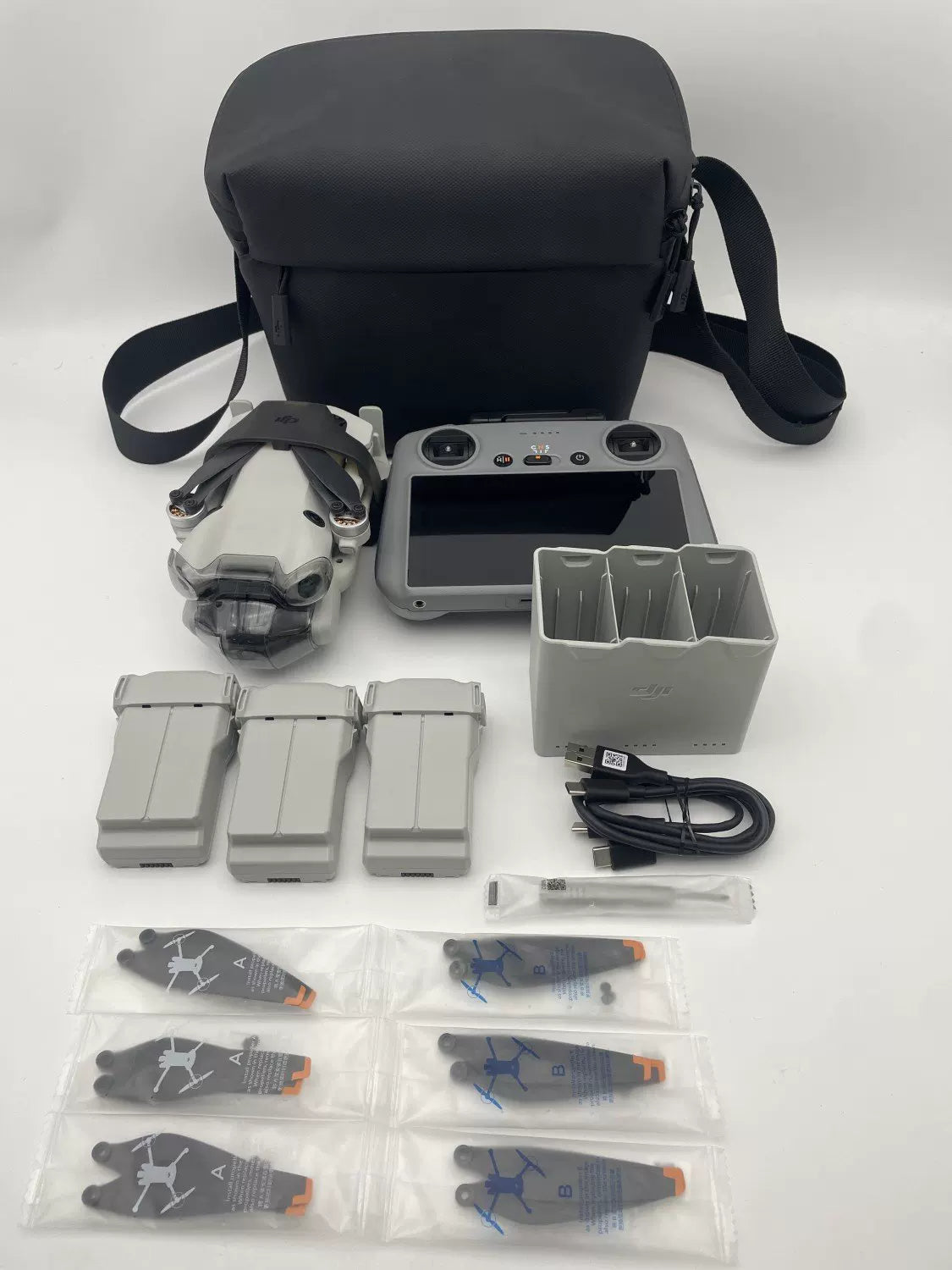 95% New (Like New) DJI Mini 4 pro with Screen, Extended Battery Fly More Combo with 2-Year