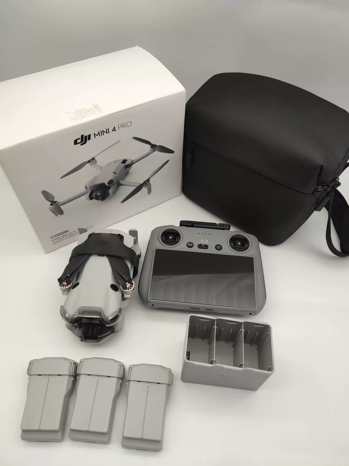 99% New (Mint) DJI Mini 4 Pro with Screen, Extended Battery Fly More Combo with DJI Care Refresh
